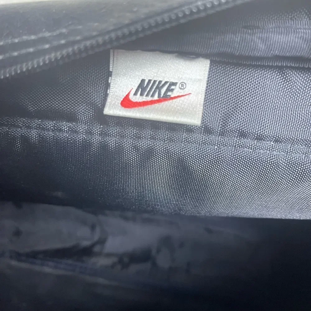 Nike Classic Black Messenger Bag with logo accent.